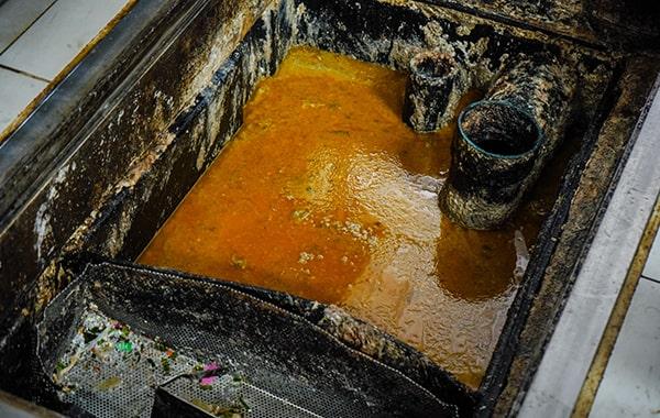 procrastinating on grease trap cleaning can cause foul odors, sanitation issues, and costly repairs